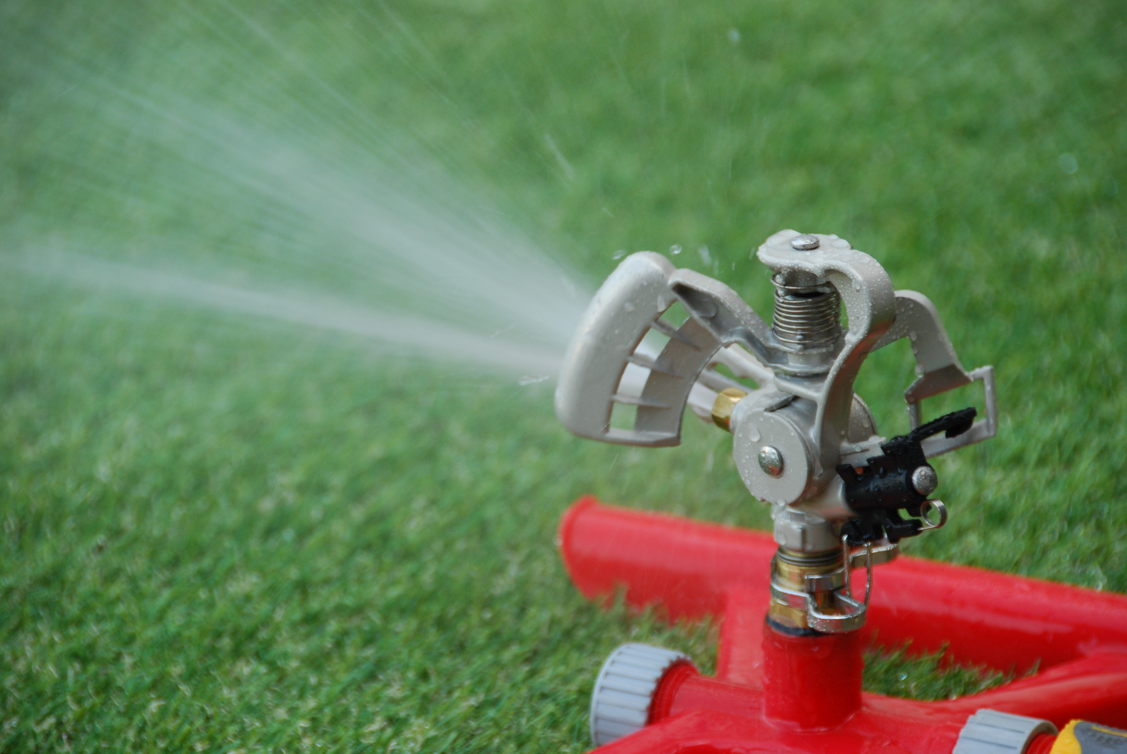 Adjustable metal impact sprinkler